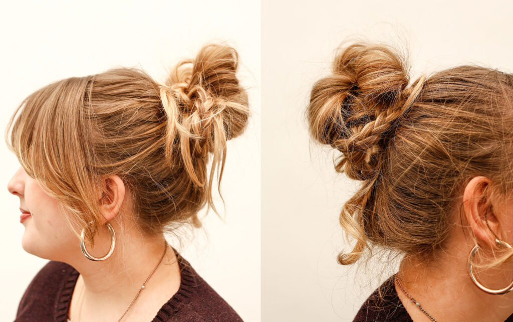 A stylists with her hair pulled back in a braided updo