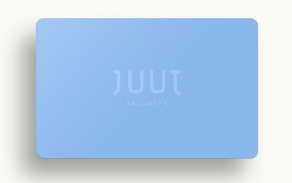 A light blue JUUT gift card.